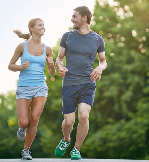 Couple running outside